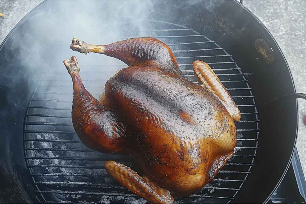 A beautifully smoked turkey on a grill rack, surrounded by aromatic smoke.